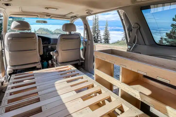 Camp N Car Home On Wheels Kit with Trunk Bunk, the best bed that fits in a minivan. This camping bed is built by Camp in Car, one of the best van conversion companies in Washington.
