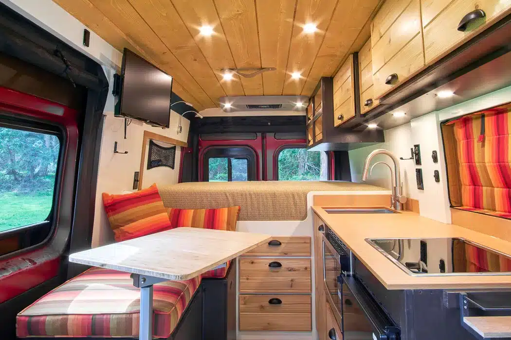 Beautiful interior of a professionally converted off-grid ready RAM ProMaster van from the team of Camp N Car located in Port Townsend on Washington's Olympic Peninsula main inside view