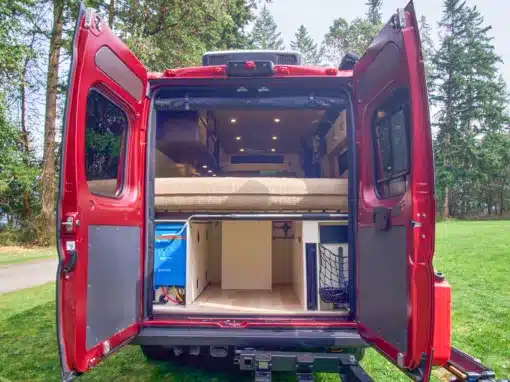 Beautiful interior of a professionally converted off-grid ready RAM ProMaster van from the team of Camp N Car located in Port Townsend on Washington's Olympic Peninsula garage of van
