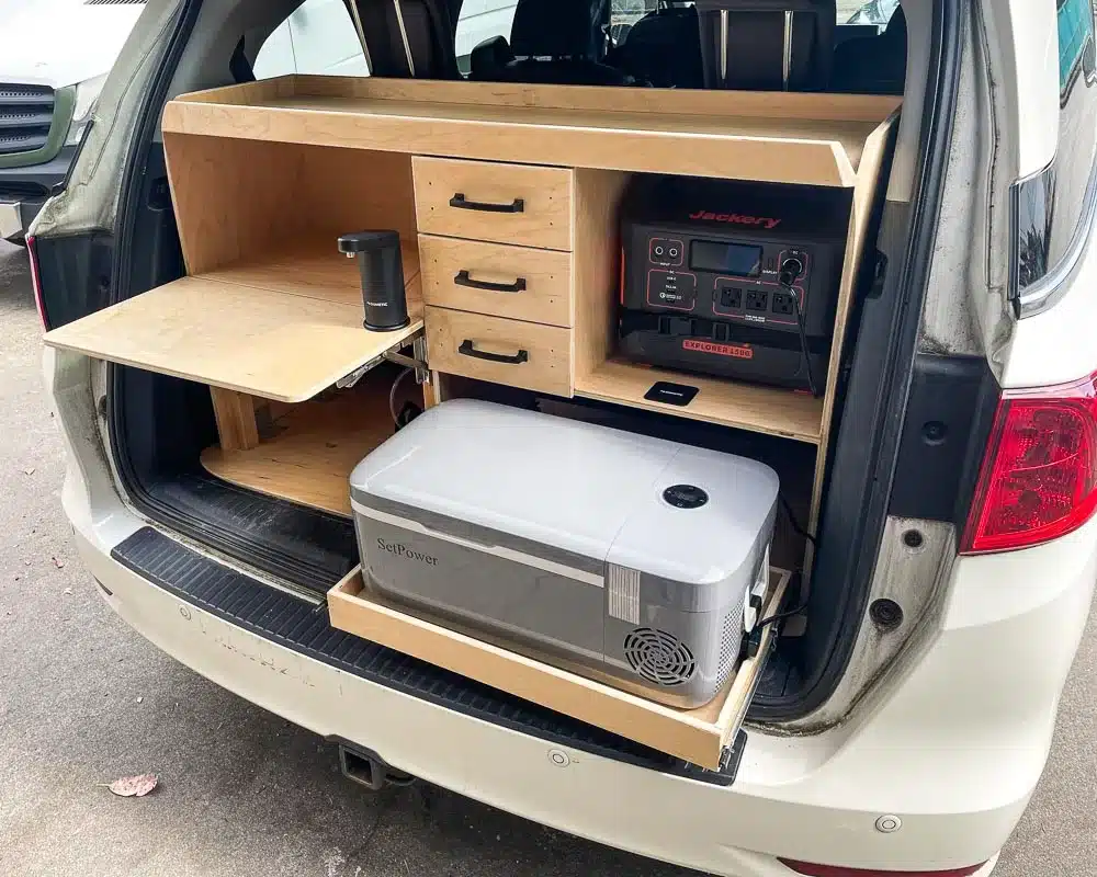 An amazing storage and camping unit built in the back of a Honda Odyssey minivan.