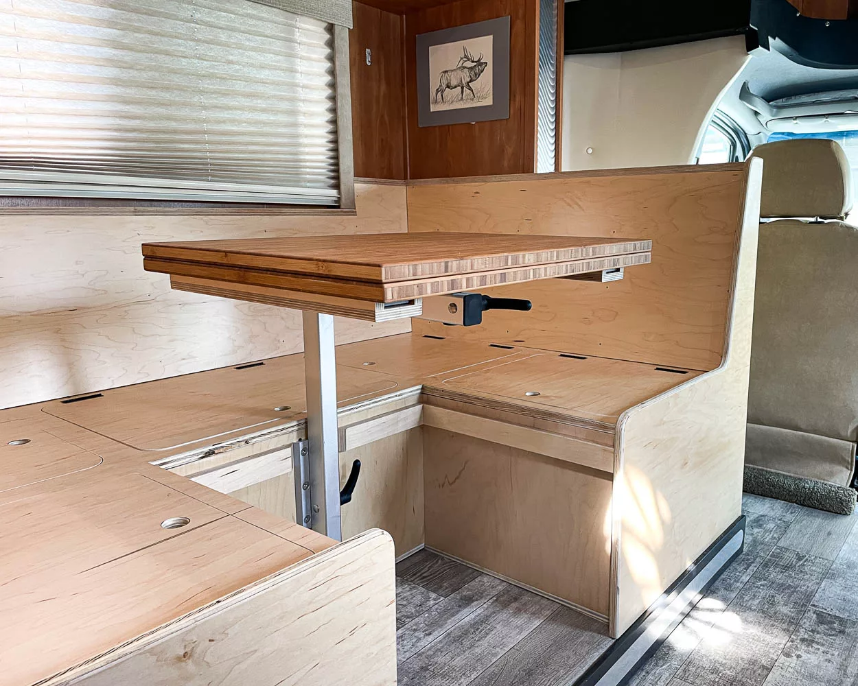 RV booth dinette upgrade in a Sprinter Chassis RV featuring extra storage, swivel table and easy conversion to a bed.