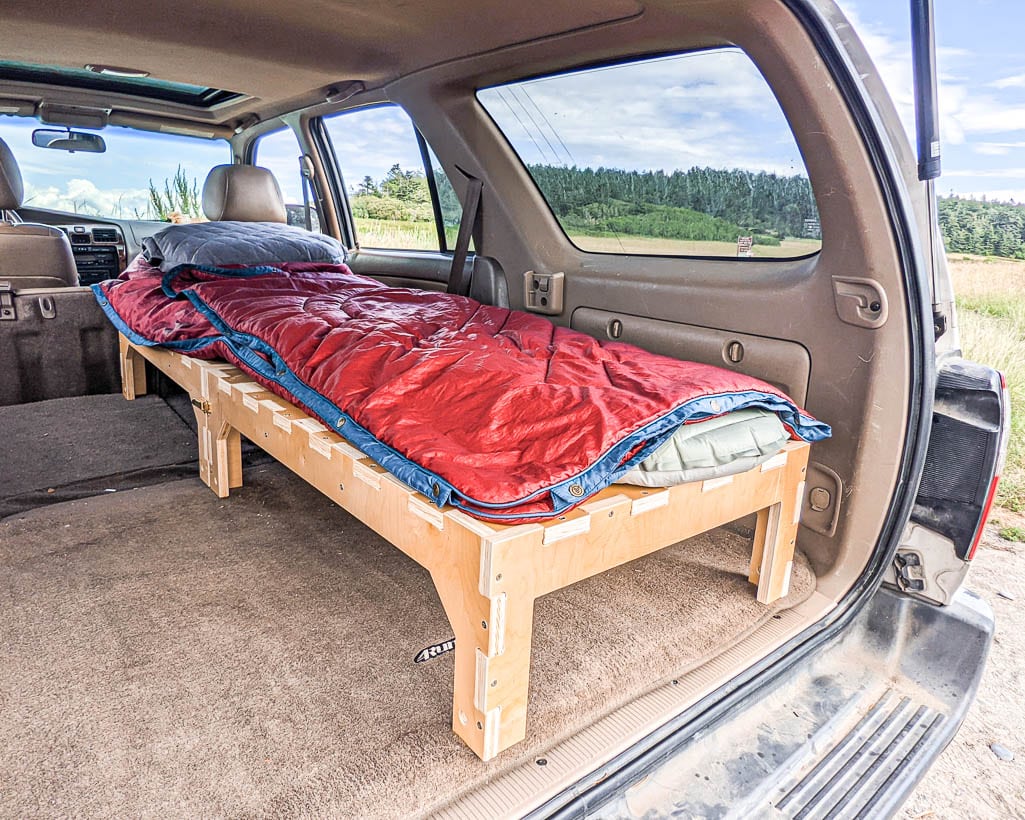 Amazing camper build for comfortable sleeping in a 2017 Toyota RAV4 that stows away in the rear cargo area made by the conversion shop of Camp N Car in Port Townsend Washington.