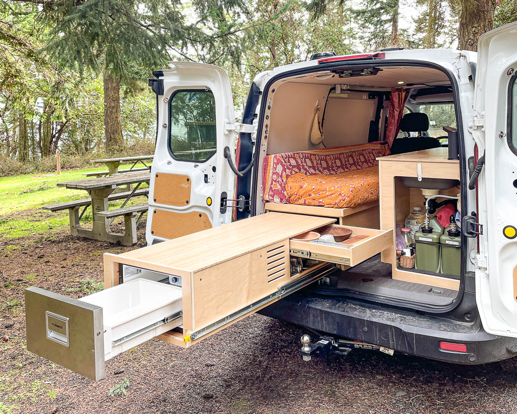 Amazing camper build for comfortable sleeping in a 2017 Toyota RAV4 that stows away in the rear cargo area made by the conversion shop of Camp N Car in Port Townsend Washington.